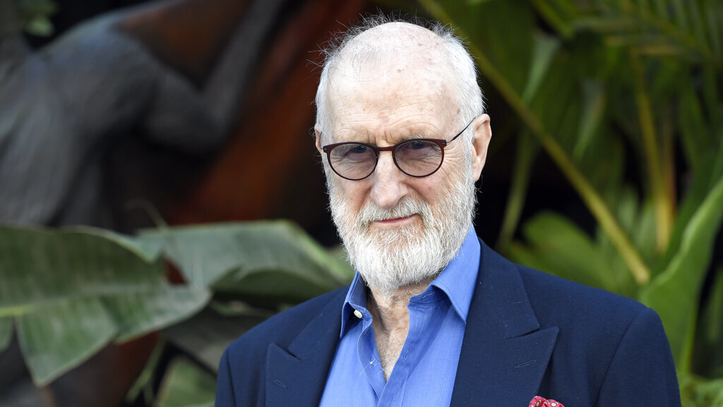 Actor James Cromwell sticks his hand to a Starbucks counter in protest.  : NPR