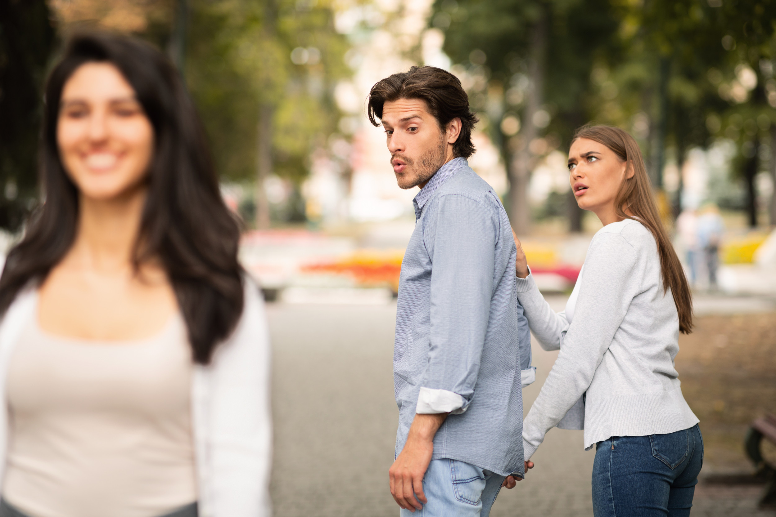 Boyfriend distracted by other woman