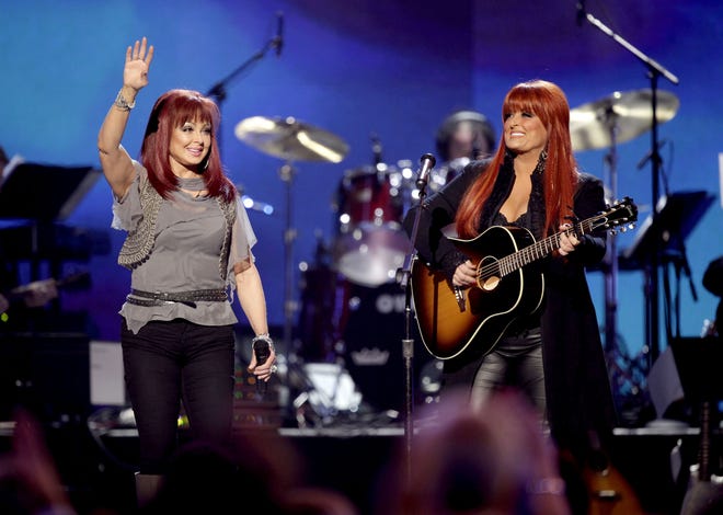 Naomi Judd, left, the Kentucky-born matriarch of the Grammy-winning duo The Judds and mother of Wynonna, right, and actress Ashley Judd, died April 30 at age 76.